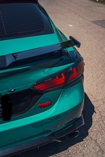 Green car wrap rear view